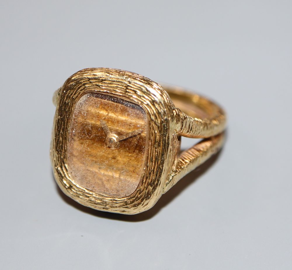 A ladys 1970s? textured 18ct gold Bueche Girod ring watch, size J/K, gross 18.6 grams.